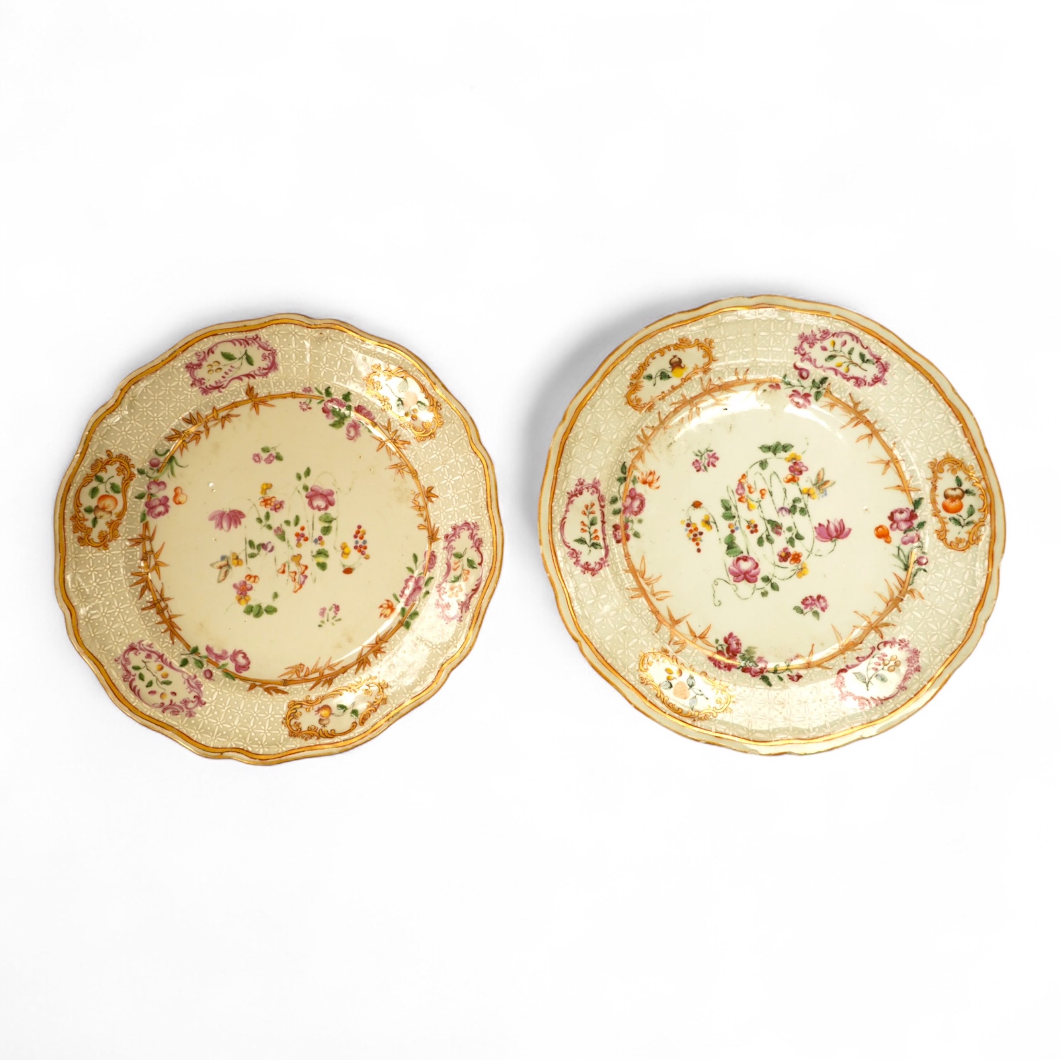 A pair of 18th century Chinese famille rose and bianco-sopra-bianco plates, 24cm